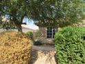 Exterior shot of beige single-story home with meticulous desert landscaping at 2637 S 156Th Ave, Goodyear, AZ 85338