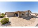 Exterior shot of the home with a covered carport, enhancing the property's practicality and curb appeal at 3301 S Goldfield Rd # 2034, Apache Junction, AZ 85119