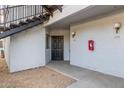 Apartment exterior with entry door, outdoor lighting, and stair access at 3848 N 3Rd Ave # 1047, Phoenix, AZ 85013