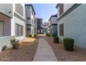 Apartment complex showcasing landscaped walkways between buildings at 3848 N 3Rd Ave # 1047, Phoenix, AZ 85013