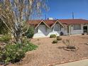 Single-story home featuring a red tile roof and low-maintenance desert landscaping at 3932 W Lawrence Ln, Phoenix, AZ 85051