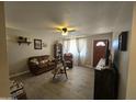 Inviting living room with light walls, modern flooring, and comfortable furnishings at 3932 W Lawrence Ln, Phoenix, AZ 85051