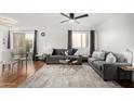 Cozy living room with stylish sofas, decorative pillows, glass top coffee table and neutral rug at 5525 E Thomas Rd # K6, Phoenix, AZ 85018