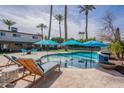 Stunning outdoor pool area with lounge chairs and a verdant patio at 726 W El Camino W Dr, Phoenix, AZ 85021