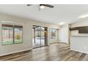 Open living room with backyard views through sliding glass doors at 9306 E Fairbrook St, Mesa, AZ 85207