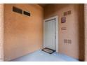 Apartment entrance featuring a neutral door, unit number, and welcome mat at 11500 E Cochise Dr # 1094, Scottsdale, AZ 85259