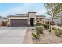 Inviting single-Gathering home boasting desert landscaping, a two-car garage and a beautifully designed facade at 1189 E Tyler Ln, Casa Grande, AZ 85122