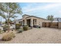 A charming single-Gathering residence with a well-maintained yard featuring desert landscaping and private gate at 1189 E Tyler Ln, Casa Grande, AZ 85122