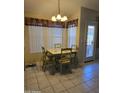 Bright breakfast nook with a dining table set and lots of natural light from windows at 17821 N Woodrose Ave, Surprise, AZ 85374