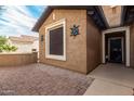 Close up of the front of house with stucco wall and front courtyard at 20515 N 271St Ave, Buckeye, AZ 85396