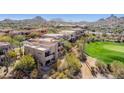 Upscale desert community with modern architecture and lush green golf course at 28518 N 101St Pl, Scottsdale, AZ 85262