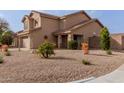 Inviting home featuring desert landscaping, stone accents, and a cozy front porch at 3234 E Marco Polo Rd, Phoenix, AZ 85050