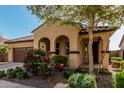 Attractive single-story home with a covered entryway and mature landscaping at 4695 N 204Th Ave, Buckeye, AZ 85396