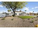 Charming modern home featuring xeriscaping, artificial turf, and a two-car garage at 5202 E Marconi Ave, Scottsdale, AZ 85254