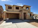 New home under construction showcasing the framing stage with a two car garage at 7449 W Buckhorn Trl, Peoria, AZ 85383
