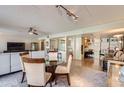 Open floor plan integrating dining area, living space, and adjacent kitchen at 7950 E Camelback Rd # 211, Scottsdale, AZ 85251