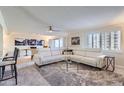 Bright living room with a plush sectional sofa, neutral carpet, and sliding doors to balcony at 7950 E Camelback Rd # 211, Scottsdale, AZ 85251