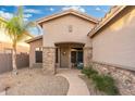 Inviting front porch with stone columns, neutral color palette, and a cozy bench at 835 E Virgo Pl, Chandler, AZ 85249