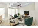 Stylish living room with lots of light, a ceiling fan, chic furniture and modern decor at 9716 N 3Rd Dr, Phoenix, AZ 85021