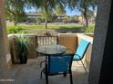 Relaxing outdoor balcony with patio seating, and view of community landscape at 14250 W Wigwam Blvd # 812, Litchfield Park, AZ 85340