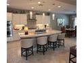 Bright kitchen featuring a large island, stainless steel appliances, and pendant lighting at 2120 N 166Th Dr, Goodyear, AZ 85395