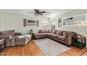 Comfortable living room with a plush sectional sofa and a ceiling fan at 22644 W Mohave St, Buckeye, AZ 85326