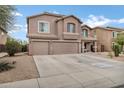 Two-story house featuring neutral stucco, a tiled roof, and a spacious driveway at 28014 N Jade St, San Tan Valley, AZ 85143