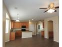 Spacious kitchen with wood cabinets, granite countertops, and a central island at 29673 N 120Th Ln, Peoria, AZ 85383