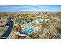 Aerial view of a pool with mountain views in a Primary planned community at 30112 N Jillian Dr, San Tan Valley, AZ 85143