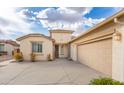 Beautiful single-story home boasts a two car garage and well-maintained desert landscaping at 32160 N Dog Leg Ct, San Tan Valley, AZ 85143