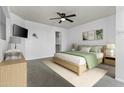 Well-lit bedroom with ceiling fan and walk-in closet provides a comfortable and organized living space at 3845 E Greenway Rd # 230, Phoenix, AZ 85032