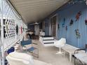 Covered patio with comfortable seating offers a relaxing outdoor space at 44 S Hawes Rd # B7, Mesa, AZ 85208