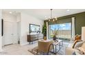 Comfortable living room with a mounted TV, neutral tones, and stylish decor at 5568 E Rock Bush Ln, San Tan Valley, AZ 85140