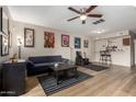 Open living room featuring stylish decor and open access to the bar and kitchen at 715 S Extension Rd # 70, Mesa, AZ 85210
