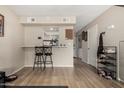 The living room includes a bar area and access to the laundry room at 715 S Extension Rd # 70, Mesa, AZ 85210