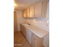 Well-lit kitchen featuring a dishwasher and plenty of cabinets for storage at 7917 E Keim Dr, Scottsdale, AZ 85250