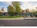 Charming modern home boasting lush landscaping, and a tranquil setting at 8433 E Cholla St, Scottsdale, AZ 85260