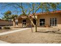 Inviting single-story home showcasing drought-tolerant landscaping and a brick facade at 13226 N Cedar Dr, Sun City, AZ 85351