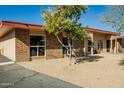 Well-maintained home featuring minimalist desert landscaping and brick accents at 13226 N Cedar Dr, Sun City, AZ 85351