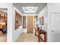 Bright foyer features light floors, shuttered windows, and decorative ceiling detail at 14302 W Laurel Ln, Surprise, AZ 85379