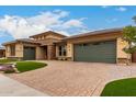 Inviting home with a large driveway and a well-maintained lawn and a two-car garage at 15936 W Bonitos Dr, Goodyear, AZ 85395