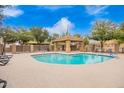 A clean community pool, featuring a shaded seating and lounging area for relaxation at 17150 N 23Rd St # 249, Phoenix, AZ 85022