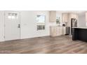 Bright kitchen featuring modern wood flooring, stainless steel appliances, and lots of counter space at 2650 W Union Hills Dr # 123, Phoenix, AZ 85027