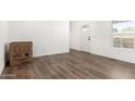 Bright living room featuring modern wood flooring, fresh neutral paint, and lots of natural light at 2650 W Union Hills Dr # 123, Phoenix, AZ 85027
