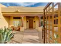 Charming front porch with comfortable seating, manicured landscaping, and a stylish entrance at 27171 N 73Rd St, Scottsdale, AZ 85266