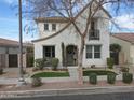 Charming two-story home with a stucco exterior, well-manicured landscaping, and a cozy front porch at 3438 E Betsy Ln, Gilbert, AZ 85296
