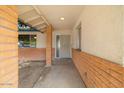 Welcoming covered front porch with brick accents and a secure screen door entry at 6707 N 42Nd Ave, Phoenix, AZ 85019