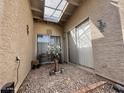 Enclosed patio area features a gravel floor, providing a private outdoor space for relaxation at 10224 E Minnesota Ave, Sun Lakes, AZ 85248