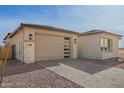 Well-maintained home with a clean exterior, desert landscaping, and a stylish garage door at 13653 W Crabapple Dr, Peoria, AZ 85383