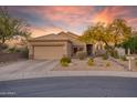 Charming single Gathering home featuring a well-maintained yard, mature landscaping and neutral color palette with a two car garage at 15848 W Lahlum Ln, Surprise, AZ 85374